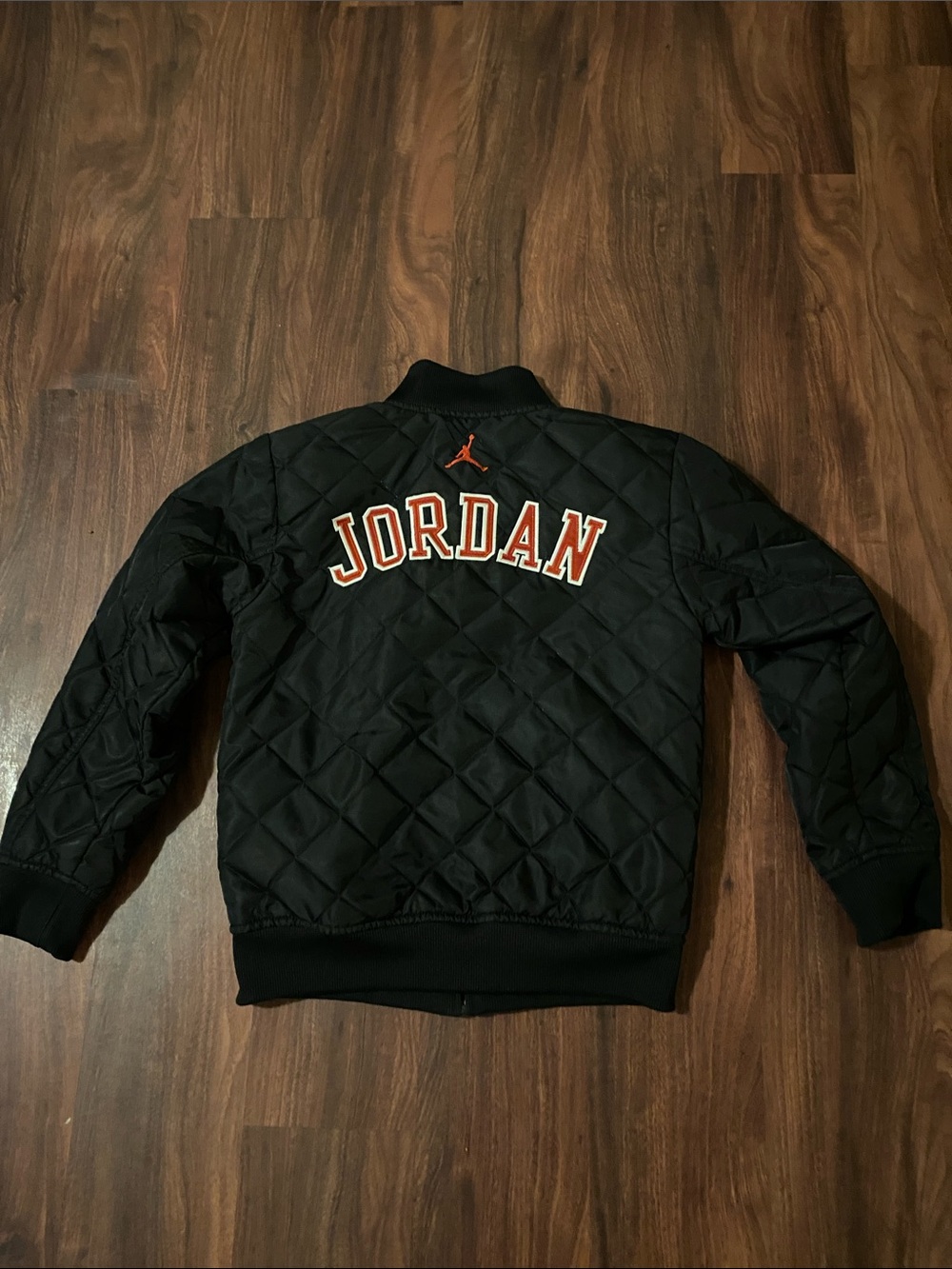 Jordan Black Quilted Bomber Jacket with Orange Accents